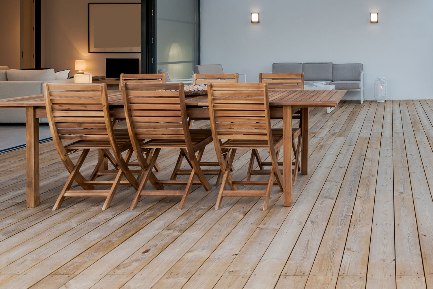 Wooden outdoor furniture on a large timber deck